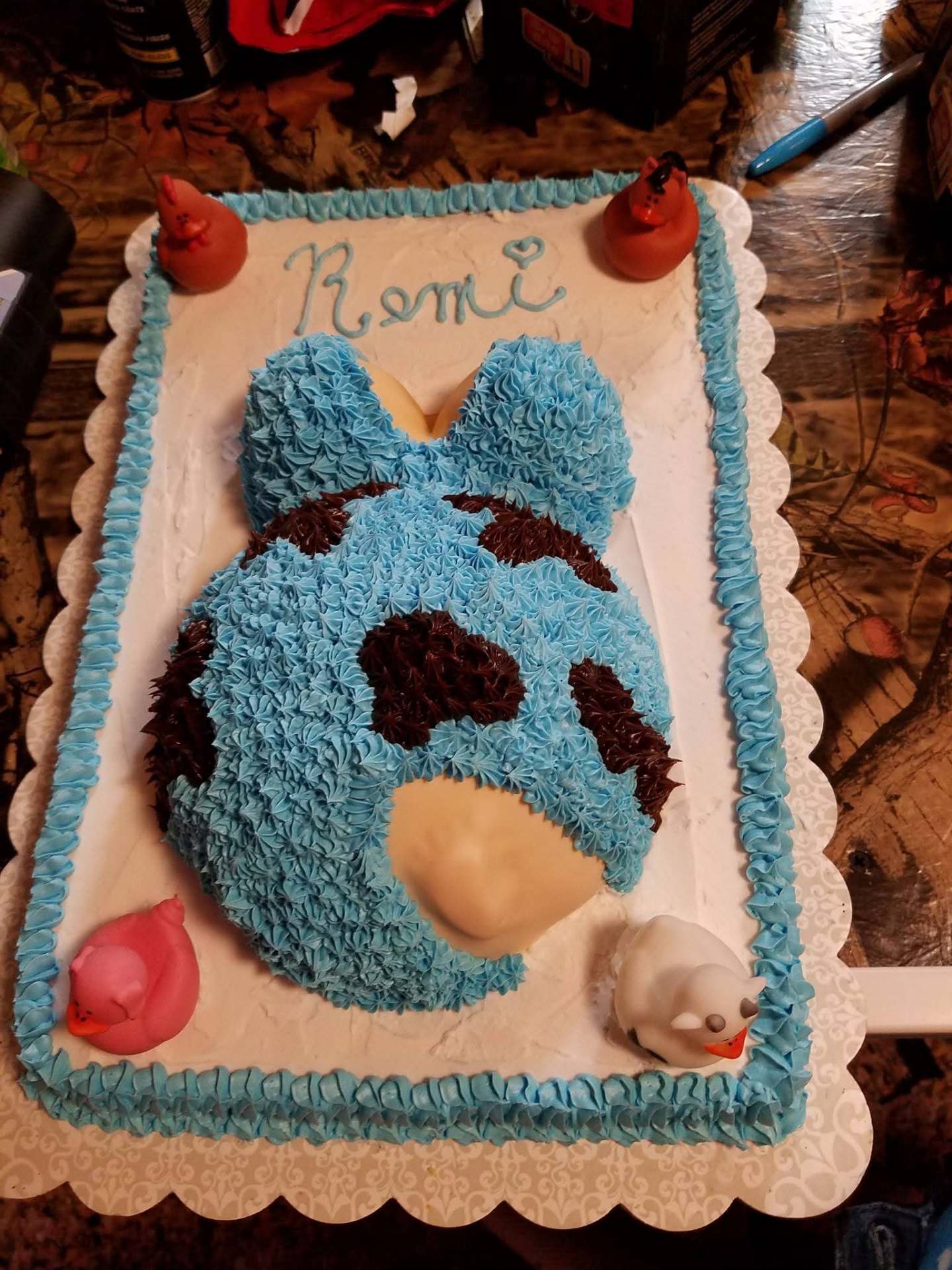 Custom Remi baby bump cake with rubber ducks